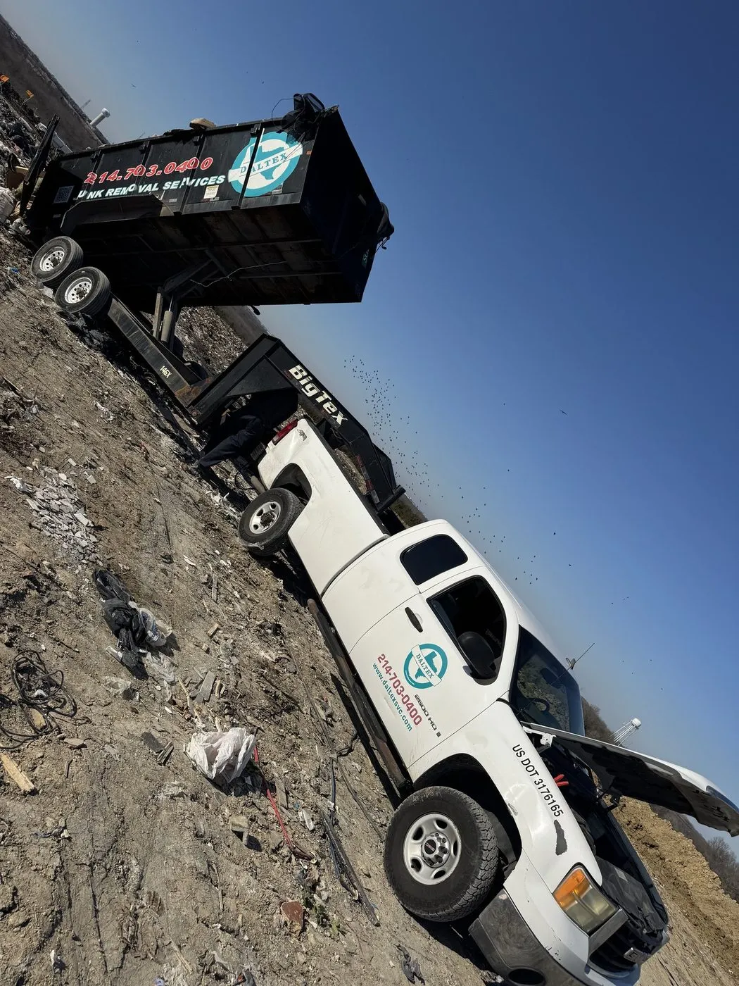 Daltex truck and dump trailer loaded with debris at a Dallas-Fort Worth job site