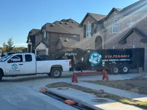 Daltex truck and junk removal trailer staged at a Dallas-Fort Worth construction site