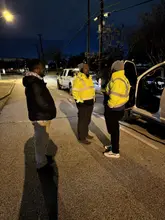 Daltex crew in high visibility gear treating a Dallas-Fort Worth property at night