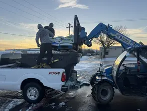 Daltex crew loading ice melt onto a service truck before a Dallas-Fort Worth winter storm