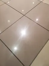 Close view of polished commercial tile and clean grout lines in Dallas-Fort Worth